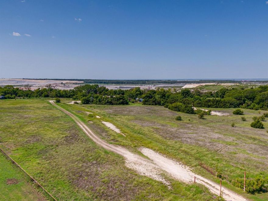 Tremendous country setting opportunity to build your dream ranch home or even develop on an outstanding, 18+ acre lot in the beautiful Ellis County! Quiet neighborhood with NO HOA and close to schools and shopping! This property is zoned for Ag and has coop water. No sewer. It also has a barn and a house on it with little to no value. Pipe fence and gate, it also backs up to a rock quarry so no building will ever happen behind the property! This is a great dream come true piece of property so come turn your picture-perfect dreams into reality before it's gone!