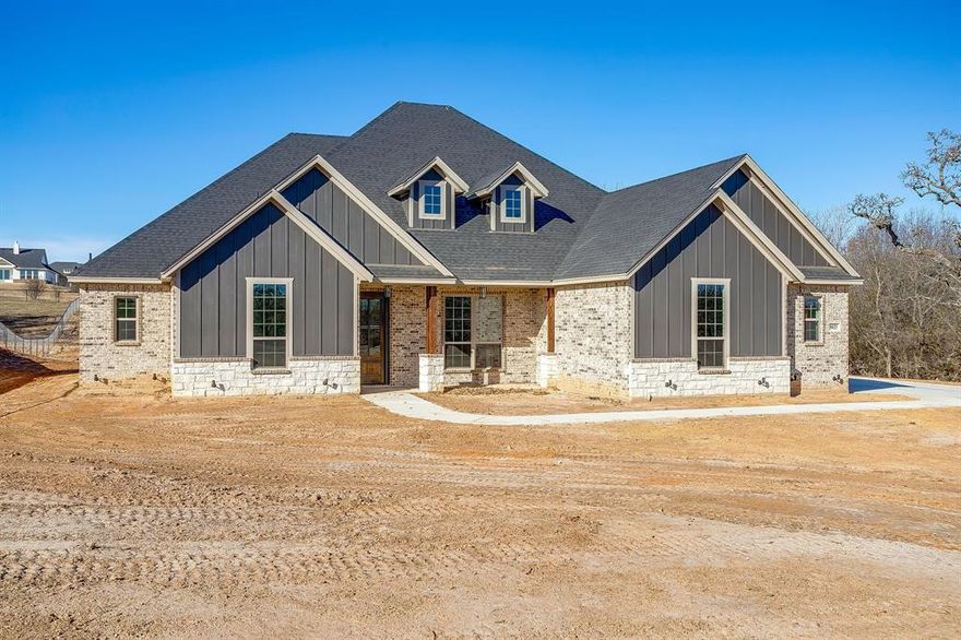 Welcome to your new country retreat in beautiful Parker County!  Sitting on 1.722 acres, this 3 bd, 2 ba, this 2300 sq ft open floor plan home allows for an easy-living lifestyle. An abundance of windows allows lots of natural light to fill the generously sized living & kitchen areas. A vaulted ceiling in the lvg room, and wonderful wood-like tile floors flow throughout the main areas of the home. Fantastic features of the kitchen include: a breakfast nook and a separate dining room, custom-built cabinets, granite counters, island with seating, walk-in pantry, separate cook-top, stainless steel built-in oven and microwave. Greet the morning with coffee, or unwind in the evening, on the covered patio overlooking the spacious backyard. Other rooms include a fantastic study with closet, conveniently located right off the foyer. At the end of the day, escape to the private  owner’s ensuite and indulge in a luxurious soak in the tub. The secondary bdrms are nicely laid out and separated from the owner’s suite and, all bedrooms and closets will have carpet. Whether you are working from home or entertaining, you will be ecstatic about calling this place your home.