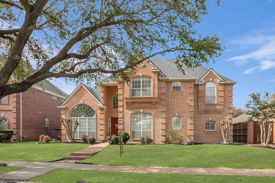 This stunning 2-story home truly embodies the essence of desirable living! Located close to shopping and top-rated schools in Plano, it boasts an inviting entryway flanked by formal living and dining areas. The open-concept kitchen and living room with gleaming hardwoods create a warm and welcoming atmosphere, complete with a cozy fireplace, built-in cabinets, and shelves. The kitchen is a chef's dream, featuring ample cabinetry, granite countertops, an island, and a spacious walk-in pantry. The master suite is a serene retreat, offering a sitting area and large windows that provide a beautiful view of the sparkling pool. The recently remodeled ensuite master bath is luxurious, equipped with a Hollywood tub, a walk-in shower, dual vanities, and a huge walk-in closet with his and her sides. Upstairs, you'll find three additional bedrooms, two full bathrooms, and a massive third living area, perfect for family gatherings or entertainment. Walls of windows offer natural light throughout the home. The outdoor space is equally impressive, featuring a sparkling pool and a covered patio, making it an ideal spot for entertaining guests or enjoying family time. The backyard is low maintenance, with a designated play space and turf that ensures you can enjoy the area without the hassle of regular upkeep. Additionally, this home boasts a spacious 3-car garage, offering plenty of room for vehicles and extra storage. Roof replaced in 2025 with Class 4 shingles. With all these features combined, this home is truly a must-see!