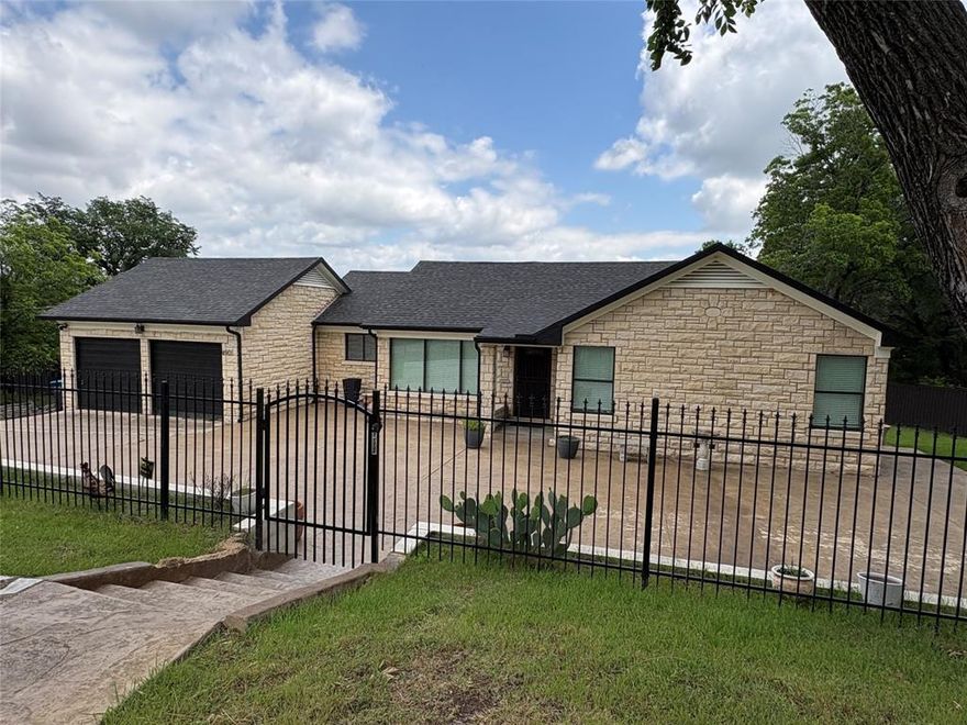 The seller of this property is Michael A. Livens, a court appointed receiver.  Melody Stovall, Vice President, at Rattikin Title Company, 3908 Interstate 20 West, Arlington, TX 76017, 817-478-6100, mdixon@RattikinTitle.com.  All information needs to be verified and confirmed by the buyer.  This fantastic home sits on approximately 2.46 acres and is within minutes from downtown Fort Worth, entertainment, shopping, Panther Island and Fort Worth's river and cultural districts  The home has been extensively updated and remodeled.  The kitchen has luxurious SS appliances, waterfall quartz countertops, custom cabinetry, a gas cooktop, a huge vent a hood, and dual breakfast bars.  The property also contains an basement area that contains a renovated bedroom and bath area and can be accessed from the outside of the home.