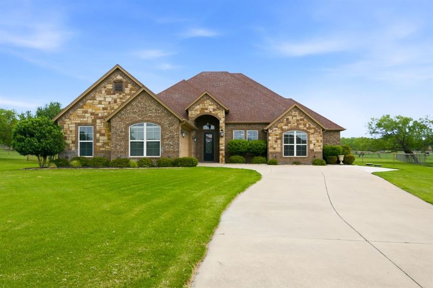 Welcome to this country retreat on 1 acre in acclaimed Aledo ISD.   Nestled on a quiet cul-de-sac in the desirable Hills of Aledo, this thoughtfully designed home offers the extraordinary blend of comfort, space, and outdoor living. Inside, you’ll find an open-concept floorplan with split bedrooms, warm and spacious living area, decorative lighting, and a gourmet kitchen featuring granite countertops, stainless steel appliances, island, breakfast bar, and abundant cabinetry.

The private primary suite is a true gem with dual vanities, separate tub and shower, and an enormous walk-in closet complete with a sitting area—perfect for a dressing, reading nook,  or private moment.  Flexible upstairs bonus room includes walk in closet space which may be utilized as 4th bedroom, game or media room, guest suite, or second living area.

Step outside to your backyard oasis featuring a sparkling in-ground pool and an impressive covered patio designed for year-round enjoyment. This expansive outdoor living space offers endless possibilities for entertaining, outdoor dining, relaxing by the pool, hosting game day gatherings, or creating your dream outdoor kitchen. With plenty of room to spread out, it’s the ideal extension of the home for enjoying Texas evenings.

Additional highlights include side-entry garage, well and aerobic septic, and a peaceful country feel just 10 minutes south of I-20 off Hwy 5, experience this rare opportunity to enjoy space, privacy, luxury amenities, and top-rated schools!