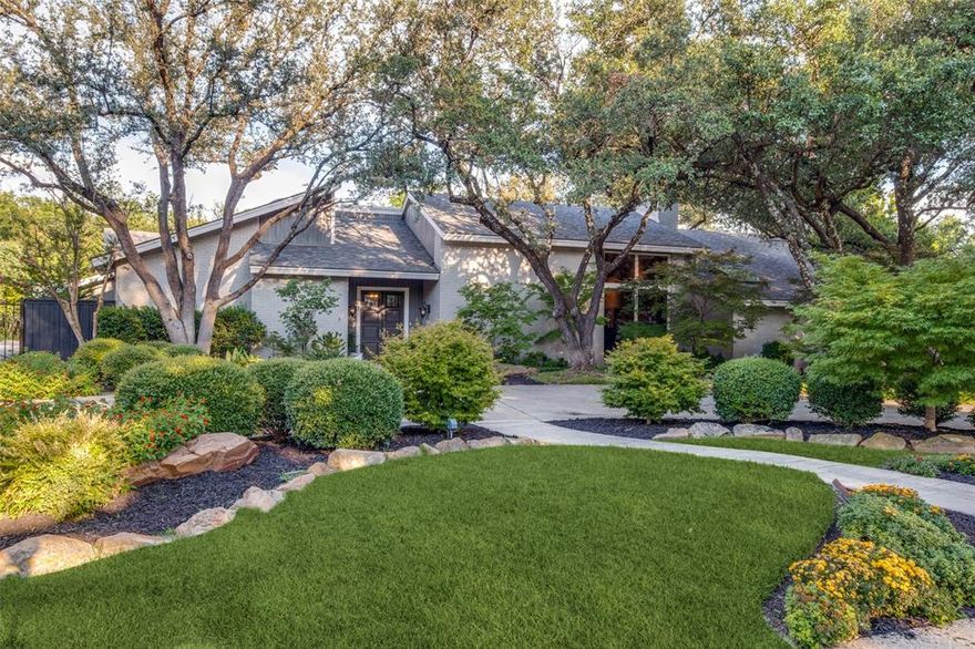 Incredible opportunity to own a stunning home on a .89-acre creek lot. This Northwood Hills Estates home with towering trees, pool,spa provides a picturesque backdrop creating a private oasis in the heart of Dallas. The interior has floor to ceiling windows (8'x6') in all major rooms with views of the pool & backyard seamlessly blending the outdoors in.  The spacious Great Room with soaring ceilings has a walk-in wet bar & is perfect for hosting lavish parties or family gathering.  The oversized custom kitchen & breakfast were remodeled with everything a chef would want including 2 islands & the walls of windows to not miss anything happening outdoors.  Tucked away in its own wing is the primary suite with a fireplace, sitting area, remodeled dual baths with heated floors, 3 wics & office with built-ins. There is a 3-way bedroom split with 2 ensuite bedrooms with a den downstairs & 2 ensuite bedrooms up with a tree top game room. Large laundry room, 3 car garage and park like backyard.