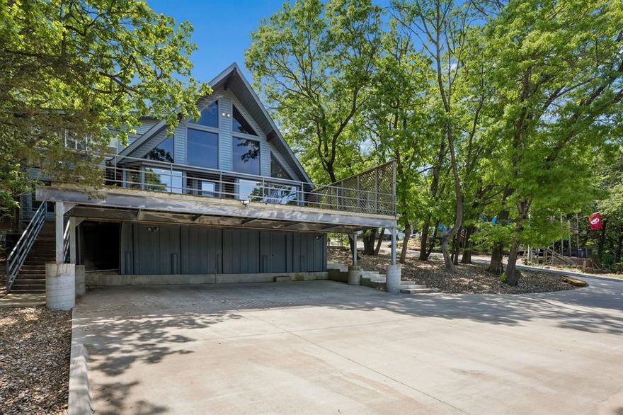 Enjoy scenic views of Lake Texoma from this spacious 2,956 sq ft fully furnished home in Pottsboro, ideally situated on four lots offering added space, flexibility, and privacy. This well-designed property features 5 bedrooms and 3 bathrooms, including two primary suites, making it well-suited for full-time living, a second home or investment opportunity. Each primary suite includes an ensuite bath and walk-in closet. One primary bath has been recently remodeled and features a walk-in shower with steam feature. The second primary suite offers a jetted garden tub, separate vanities, and a private refrigerator for added convenience and comfort, creating ideal accommodations for owners and guest. The interior showcases hardwood floors, vaulted ceilings, and an open-concept layout that provides a functional flow for everyday living and entertaining. The kitchen is equipped with an island, breakfast bar and opens to the dinning area, where window frame views of the lake. The family room features a wood-burning fireplace, creating a comfortable gathering space. Additional living areas include a sunroom filled with natural light and a loft with a reading nook, offering flexible space for a home office, game room or guest accommodations. outdoor living is enhanced by a covered deck with teak wood flooring, providing a space to enjoy the surrounding setting and lake views. The four-lot configuration allows for expanded outdoor use, additional parking, or future improvements, subject to local regulations. Property features include 3 HVAC systems, two recently replaced water heaters, a water softener, and generous storage throughout the home. This property presents strong potential as a short term or long term rental investment, second home, or primary residence. Buyer to verify all local regulations, usage and rental restrictions. BOAT DOCK available for separate purchase, buyer to verify availability, permitting, and details. Voluntary HOA; Buyer to verify.