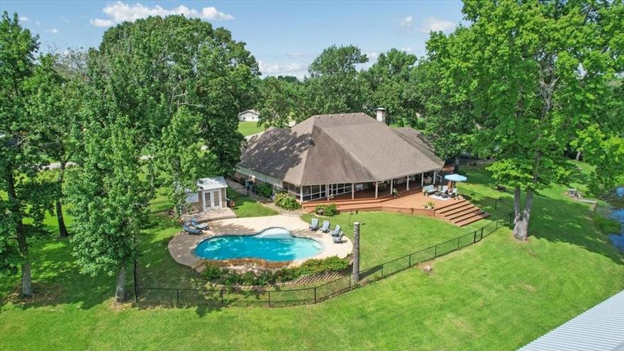 Experience the ultimate lakeside retreat at this exceptional property on Lake Athens — known for its crystal-clear waters, excellent fishing, and peaceful atmosphere, just 1.5 hours from DFW. This stunning home offers the perfect blend of luxury and comfort, ideal for both entertaining and unwinding. Step inside to a spacious, open-concept layout where the living, dining, and kitchen areas flow together effortlessly. The newly updated kitchen is a chef’s delight, showcasing sleek quartz countertops, abundant cabinetry, and a large island that’s perfect for gathering with family and friends. The oversized primary suite is your private sanctuary, complete with a beautifully updated en-suite bath and a screened-in porch — a perfect spot to start your mornings with coffee and serene lake views. A well-designed laundry room connects directly to the primary bath, adding everyday convenience. Upstairs, a large game room provides versatile space for play, hobbies, or relaxation, while two dedicated office spaces on the main level make working from home a breeze. Outdoors, the property continues to impress with two separate two-car garages joined by a covered carport, offering ample parking and storage. Above the garages, you’ll find generous additional storage space. The expansive lot is ideal for enjoying the outdoors, featuring a sparkling pool, pool house, and a private boathouse with dock — perfect for spontaneous lake adventures or soaking up the peaceful, natural surroundings. Whether you're looking for a weekend getaway or a full-time lakefront lifestyle, this remarkable home offers an unmatched combination of space, elegance, and tranquility — all nestled in a quiet, wildlife-rich neighborhood. *Seller is offering a carpet allowance with an acceptable offer.