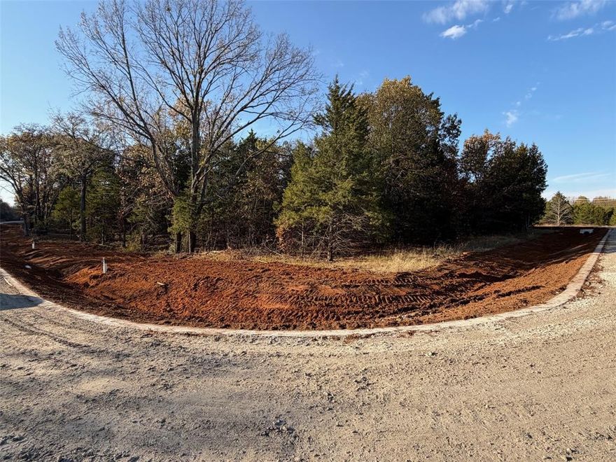 JUST TWO BLOCKS FROM LAKE TEXOMA. Great interior corner lot on fifth of an acre in the desired subdivision of Reflection Bay. A new home build could have a potential lake view from second floor balcony. Rock Creek Resort is part of the beautiful master planned golf course-lake community located on the fabulous Texas shores of Lake Texoma, 60 minutes north of DFW. Even the pickiest homeowner will love this location within the Reflection Bay neighborhood, growing steadily with attractive, custom luxury homes.  Property ownership gives you access to all amenities i.e. fishing, boating, pool, club house, restaurant, fitness center, tennis-basketball-pickle ball court & golf membership.