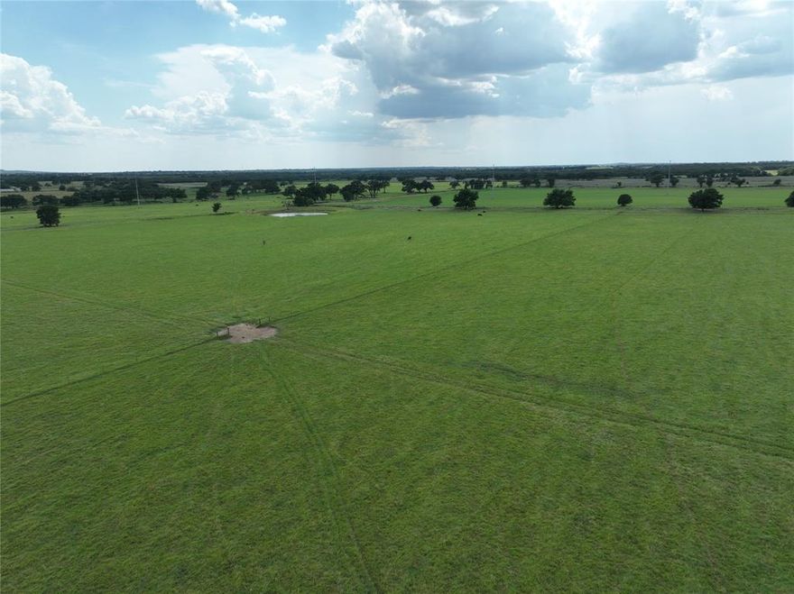 CATTLEMEN THIS IS IT If you are looking for a great place to run livestock you won't find a better piece of property. This property consists of approximately 743 acres of prime grassland that has been improved in the last few years. Grasses include 370 acres of deep Coastal Bermuda with the remainder planted in a Native mix of both Little and Big Bluestem, Indian Grass, Switch Grass, and Klein Grass and is currently about waist high in most places. The property has all new 8 strand barbed wire fencing around the perimeter and new 6 strand barbed wire interior cross fencing. There are 2 new sets of large pipe pens with one equipped with an Arrowquip Bud Tub, Alley, and Chute. 2 gravel fenced hay lots for hay storage. Water is abundant with 16 stock tanks, 4 water wells, and a Coop water meter. 3 electric meters supply power for all your electrical needs. Also included is a small Pecan Orchard consisting of approximately 50 trees. Access is available from county roads on 4 different sides. Cattle are high right now and this piece of property will keep them fat and sassy! Call today.
