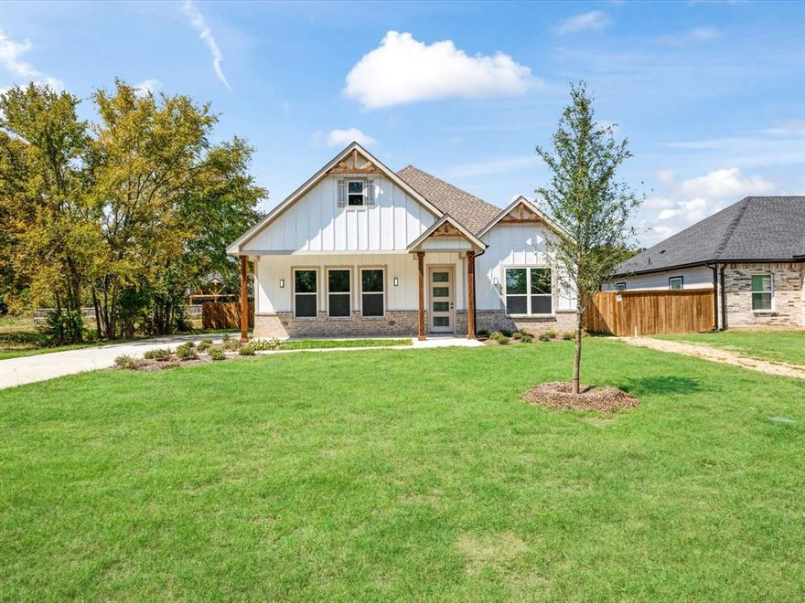 4-bedroom home offers a split, open-concept floor plan with soaring ceilings that create a bright and spacious feel. The kitchen features elegant granite countertops, while the cozy fireplace adds warmth and charm to the living space. Enjoy both a covered front and back porch perfect for relaxing or entertaining. The side-entry garage enhances curb appeal, and the large backyard opens up endless possibilities. Have a boat? You can conveniently park it right in your own backyard. The property is also equipped with a full sprinkler system and exterior lighting that beautifully frames the roofline, giving the home an inviting glow day and night.