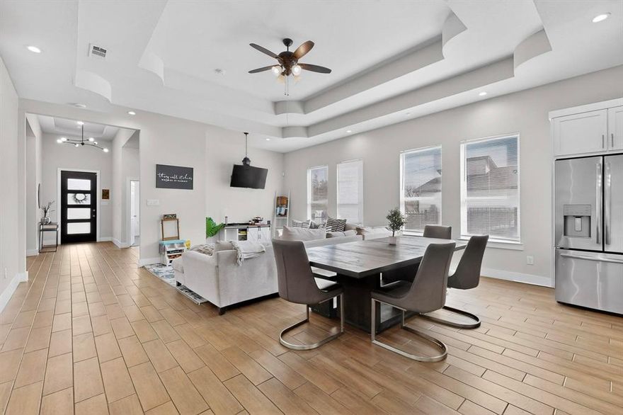 Built in 2021, this like-new home features a versatile open layout nestled on a spacious, fully fenced corner lot. Step off the covered front entry into this bright & airy one-story complete with gorgeous vaulted ceilings, modern fixtures & great natural light throughout. A cozy living room flows seamlessly into the dining area & kitchen, accented by a wall of windows in the main space. Kitchen is complete with a large island & breakfast bar, SS appliances, pantry & ample cabinet storage, with a full laundry room located between the kitchen & garage. Expansive primary suite features room for seating & an ensuite with dual vanities, rain shower, Hollywood bath & huge walk-in closet. Secondary bed & bath are on the opposite end of the home. Remaining bedrooms share a full bath, each with ample closet space. Outside, enjoy a fully fenced, private backyard complete with mature shade trees & plenty of room for pets & play. Plus, an electric driveway gate AND an attached 2-car garage for extra security. Don't miss this charming home priced to SELL!