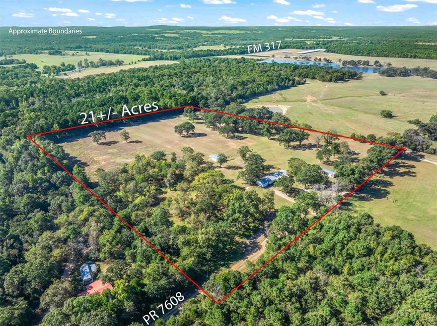 Experience East Texas country living at its finest at the very end of a private road on this stunning 21+ acres property with a pond, breath-taking views in every direction.  The metal exterior 2132 SF home combines rustic character with all the comforts, featuring beautifully refurbished real wood parquet floors, shiplap ceilings, and a split mater layout. The open concept, living, dining kitchen makes this feel like home! Kitchen boasts custom cabinetry, while the master bath offers a relaxing soaker tub. Enjoy the serenity of the countryside from large front and back porches- perfect for watching wildlife or hunting deer right from your back porch! The insulated 24x36 shop with electric and a half bath makes the ideal workspace, while there also is a 30x45 barn and a greenhouse with water that makes the ideal space for gardening projects. Oversized two car garage with even more workspace. Additional updates and features are recent HVAC, metal roof, high speed fiber optic internet. Out of city limits and no restrictions so this property offers everything- privacy, functionality, and the peaceful lifestyle that only East Texas can provide!  Brownsboro ISD