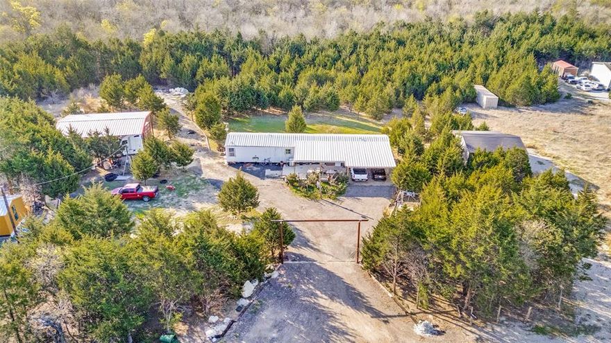 Discover the potential of this unique 10-acre property located between Palmer and Ferris. Offering a blend of rural charm and investment opportunity, this property features two single-wide homes, making it ideal for multi-generational living or rental income.

One of the homes has been partially remodeled and is ready for your finishing touches—perfect for customization or use as a rental property. The second mobile home is currently owner-occupied and provides comfortable, functional living space.

A beautiful creek runs through the property, adding natural character and making it well-suited for outdoor enthusiasts. With ample space for livestock, recreation, or hunting, this land offers endless possibilities for those seeking a country lifestyle.

The property also includes a large metal carport designed for semi-truck parking, adding valuable functionality for owners needing equipment or commercial vehicle storage.

Whether you’re looking to invest, expand, or settle into a peaceful rural setting, this property combines versatility, privacy, and opportunity—all within convenient reach of nearby towns.

Don’t miss your chance to own a slice of Texas countryside with income-producing potential.