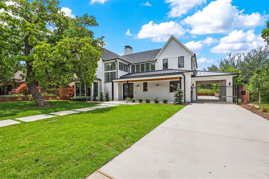 Stunning contemporary home collaboration by Otto Design & Build, Braswell Homes and interior designed by Local Life Design. Built for entertaining in established Crestwood neighborhood. This two-story home wraps around the resort-style pool for incredible views and is complete with a pool house, outdoor kitchen, and stunning landscape. Enter through the custom entry doors, you are met with an expansive open living and kitchen area, surrounded by windows that overlook your outdoor oasis. The luxurious kitchen is complete with quartz countertops, matte maple cabinetry, high-end lighting, and  large butler’s pantry with a secondary sink and wine fridge. The arched doorways, beamed ceilings, and grandiose fireplace provide an immediately desirable atmosphere.  Enjoy your private primary bedroom tucked away on its own wing of the first floor with views of the pool, complete with a stunning en suite bathroom featuring modern finishes, a large walk-in closet, and a luxurious freestanding tub.