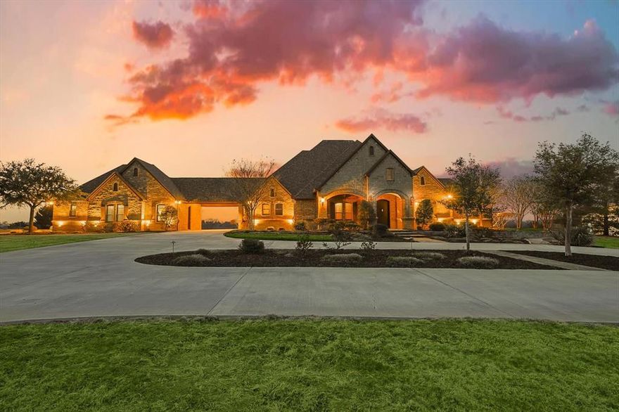 No expense spared in crafting this exquisite estate. The custom-built home boasts premium upgrades, featuring hand-scraped hardwoods, soaring beamed ceilings, Pella windows, built-ins, solid wood plantation shutters, ornate woodwork & steel Durango front door. The thoughtfully designed floor plan offers a predominantly single-story layout, w game room & wet bar tucked away upstairs. Study, gym room, dog wash & more! The property makes a statement w over 500' of stone & 3-rail pipe fencing on the frontage. A grand stone entrance welcomes you to a quarter-mile concrete drive, guiding you past the pond to the residence & spacious shop. The resort-style pool is a focal point, complete w a grotto, slide, outdoor kitchen & ample space for entertainment. The 30x40' shop has electric, water & 1 RV & 1 standard roll-up door. Attached garages provide 6 spaces, epoxy floors, custom cabinetry & surround sound. 2 water wells, ag exempt, picturesque creek meanders through the back of the property.