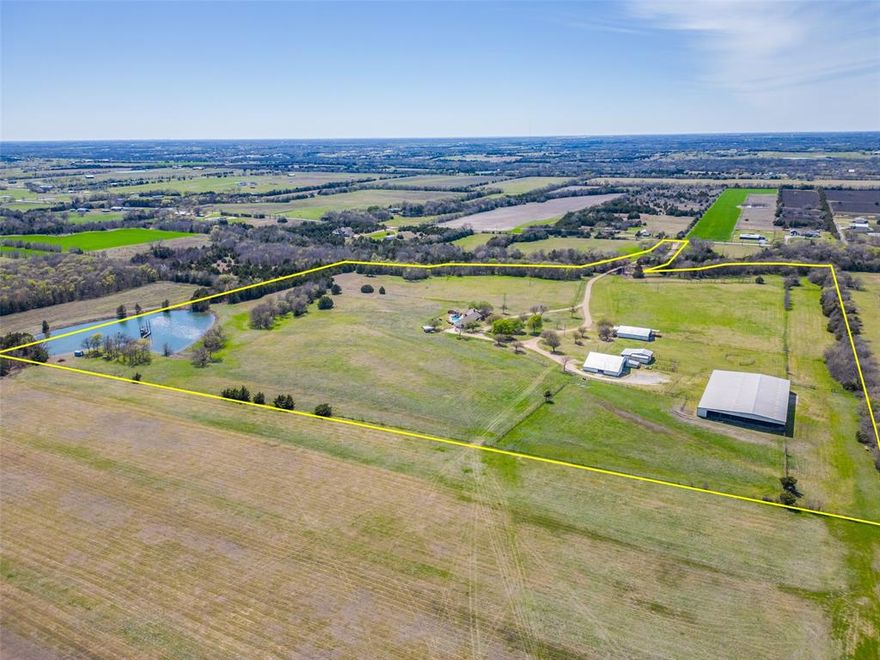 Experience the ultimate private ranch lifestyle on 46+ breathtaking acres in Blue Ridge, Texas — a  Collin County community offering peaceful country living while remaining within convenient reach of the Dallas Metroplex. Located just minutes from McKinney & approximately one hour to Downtown Dallas, this property offers the rare combination of seclusion, accessibility, and long-term investment potential.Set well off the road and surrounded by expansive views, this completely private custom brick ranch home captures spectacular Texas sunrises & sunsets across rolling pastureland. The thoughtfully designed residence features 4 bedrooms and 3 full baths,  a spacious living room anchored by a cozy fireplace, & a charming kitchen and dining area. The primary suite offers a generous retreat with an en-suite bath & walk-in shower. Designed for serious equestrian or ranch use, the property includes an impressive 80’ x 170’ covered riding arena with roll-up side doors, eight stalls, and wash rack. A large climate-controlled office with efficiency apartment adds functionality for business operations, trainers, or guests. Additional barns, cross-fencing, and outdoor arena space provide versatility for boarding, training, cattle, or recreational use. Outdoor living is equally exceptional. A resort-style pool &  spa with water feature, gazebo, and open patio create the perfect setting for relaxing in total privacy while overlooking the land. A stocked pond with a two-story dock and fishing pier enhances the recreational appeal. Private on-property riding trails wind through the acreage, offering true ranch immersion. Recent improvements include updated quartz kitchen countertops, new roof, doors, and windows. The property also features a garage with RV hookup and wildlife exemption for valuable tax advantages. Whether for a private family compound, equestrian facility, recreational ranch, or long-term land investment, this property offers scale, privacy, and strategic location.