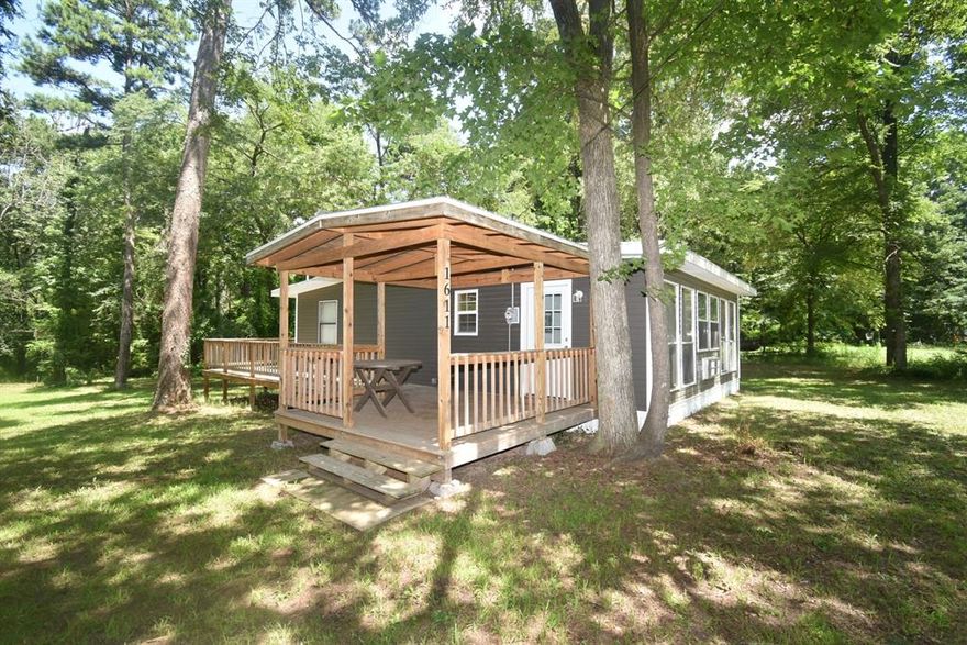 Affordable cottage style home in Yantis Tx on .817 acre, near the shores of World Famous Lake Fork. Property has available leaseback from the SRA on Glade Creek leading to the open waters of Legendary Lake Fork. Home has 1 bedroom, 1 bathroom and a huge utility room that doubles as a 2nd bedroom. Huge covered deck with decking that wraps around to the back of the home plus a storage shed out back. Access to Lake Fork when lake is full, but fishing in the creek is awesome for sure. This would be a perfect weekend fishing cabin or a daily rental property for extra income. Or even downsize and make this your permanent residence. All furnishings are negotiable! Bring your best offer! Buyer to verify any and all information.