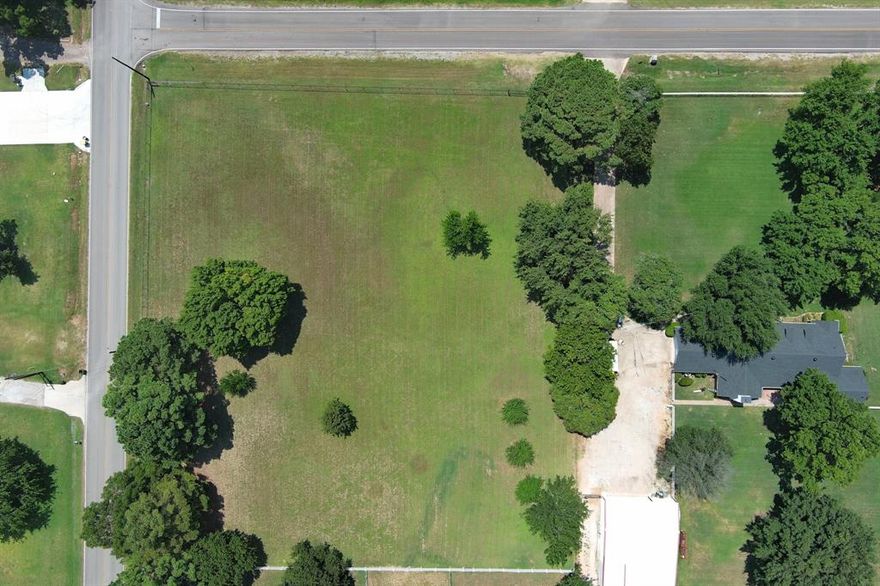 Quality building lot located outside of city limits. In an area with estate properties but the possibilities are endless. Arlington water tap on property.