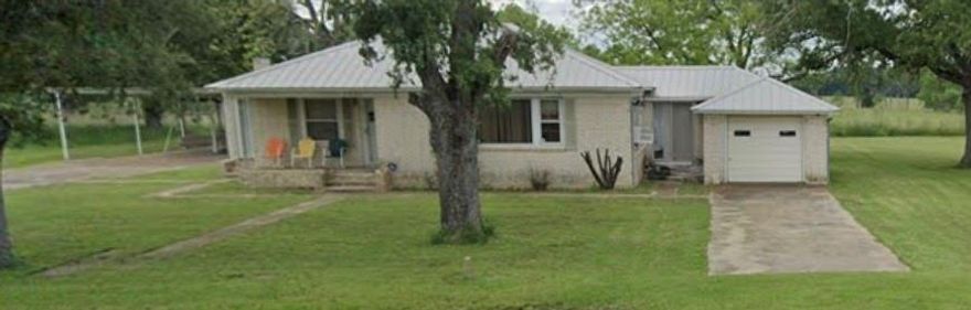 Set on a full acre in a quiet, tree-lined neighborhood, this adorable home offers small-town charm with big potential. With a bit of updating, it could truly shine as a cozy primary residence or weekend getaway. The large backyard is ideal for outdoor entertaining, gardening, or simply enjoying the peaceful surroundings. Bonus features include a one-car garage, covered carport, and an extra storage area for all your tools and gear. Property is being sold as-is—no repairs will be made. Don’t wait on this one!