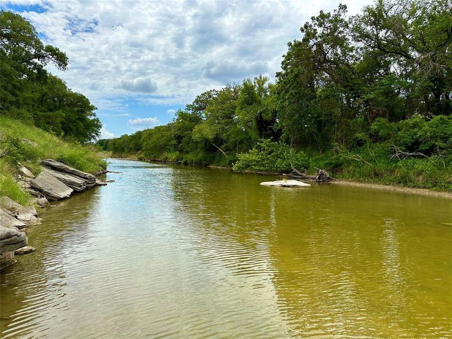 Experience country living at its finest at this remarkable 203-acre property in Hico, Texas. With 1,800 ft of water frontage on Daffau Creek and 5,611 ft on the North Bosque River, immerse yourself in the serene ambiance created by flowing water and natural wonders. The 3,840 sq ft main residence offers 5 bedrooms, 6 bathrooms, a spacious kitchen, and stunning views of the Bosque River.Flexible living spaces, wrap-around porches, fireplaces, and additional buildings cater to a luxurious lifestyle. With an equipment barn and a Hill Country-style dairy barn, this property is perfect for outdoor enthusiasts. Embrace the tranquility and indulge in the natural splendor of this enchanting property. House comes fully furnished!