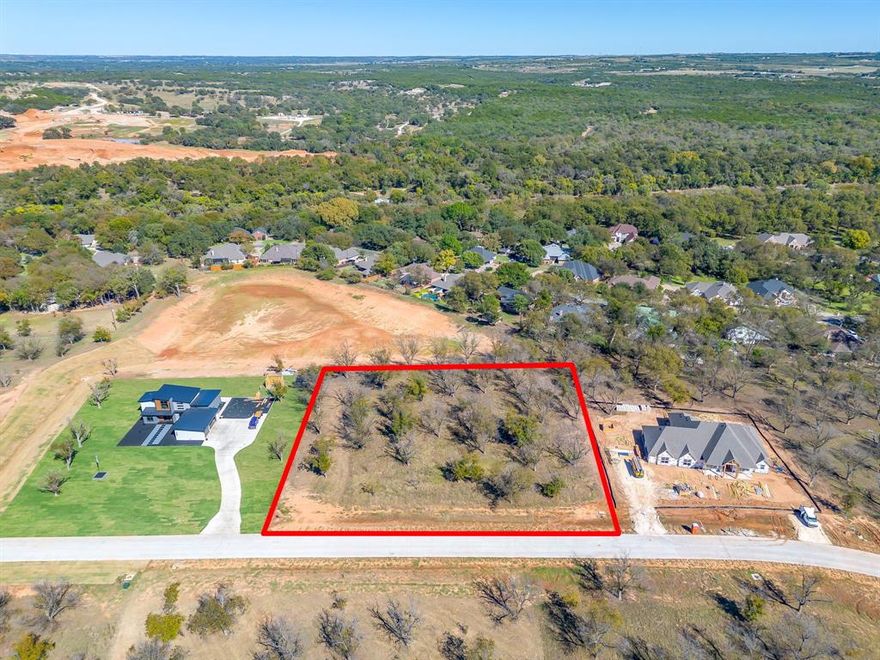 Welcome to The Landings East at Pecan Plantation, LOT 3865, 1148 East Landings North, 1.507 ACRES. Beautiful lot full of Pecan trees. Perfect setting for those that desire no home behind them. There is a wonderful reserve area that will not be built on which allows for more privacy & space. LOT measures 249 x 266 x 251 x 256. Site is complete with concrete roads, electric service, MUD water, MUD sewer. Orchard irrigation & high speed internet available. Min SQFT to build is 2,000. No time frame to build and you may use any builder. Discover the exceptional lifestyle of Pecan Plantation, a private, gated community nestled along 17 miles of the historic Brazos River within a 4,200 acre pecan orchard. Enjoy resort style amenities including two championship golf courses with full practice facilities, a full-service clubhouse with multiple dining options, marina with access to Lake Granbury, tennis & pickleball courts, pools, dog park, riverside parks, Airparks, camping, & 24 7 security with Fire & EMS services. The Village, features a bank, grocery store, restaurant, Pecan Medical Clinic, PT Services, pharmacy, golf cart shop, Vet Clinic, car wash, & Ace Hardware. Just minutes from the Historic Granbury Square officially the “Celebration Capital of Texas” under an hour from Fort Worth. Experience the perfect blend of tranquility, recreation, and convenience. Come see why you’ll want to build your dream home here! PPOA Mandatory Membership as of 9-1-25: PPOA Transfer Fee $1,091.00 + 73.65 (tax) = $1,304.49. Initiation Fee $4,381 EQUALS: $5,545.65 The monthly fee is $204.75 and includes trash service or $182.75 without trash service. Search YouTube 'Airplane Ride Around Pecan Plantation Rebecca Van Buren' to learn about our amazing community.