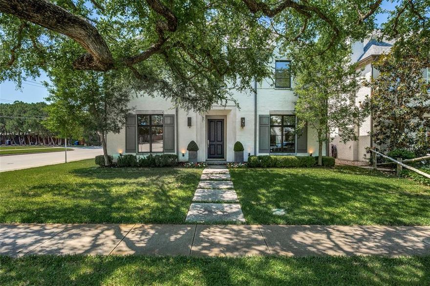 Discover an exceptional opportunity to reside in Dallas' coveted Devonshire neighborhood. This stunning transitional home, situated on a meticulously landscaped corner lot, exudes timeless elegance. Built in 2014, this pristine residence boasts marble countertops, premium Sub-Zero and Wolf appliances, PELLA windows, Bevolo gas lanterns, over 300 sf of versatile bonus space, and exquisite custom moldings throughout. The spacious game room with a bar and a convenient downstairs bedroom and bathroom enhance its appeal. This home offers walkable access to premier shopping and dining. The outdoor living area, complete with a fireplace and built-in grill, ensures year-round enjoyment. With impeccable interior finishes, this home is sure to captivate even the most discerning buyer.