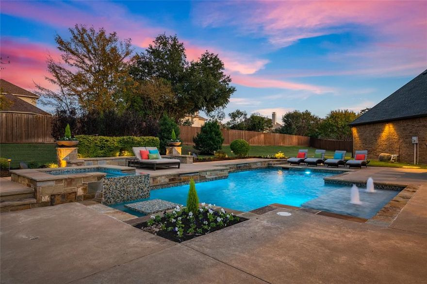 ***PRICE IMPROVEMENT!*** Gorgeous resort-style backyard featuring a pool built by the award-winning Claffey Pools. Thoughtful details include a spa, built-in table, elevated tanning ledge, wired speakers, custom landscape lighting, all surrounded by plenty of grassy play space. Covered back patio with fireplace, outdoor kitchen with built-in gas grill, bar seating for 6 guests. Meticulously maintained, one-owner, custom home in the quiet Camden Park subdivision. This is a rare combination of a true custom finish-out, privacy, and functional yard space. The kitchen has been recently updated with a large center island and amazing Fantasy Blue Satin marble countertops. Stainless steel appliances, including a 6-burner gas range and double ovens. Huge walk-in pantry and butler’s pantry with wine storage and refrigerator. Exceptional floor plan with the kitchen open to the living room and breakfast space, plus a first-floor media room, home management desk, and utility room all within steps of the kitchen. Dedicated office with French doors, vaulted ceiling, and built-in bookshelves. Primary bedroom retreat featuring a seating area, dual vanities and closets, a jetted tub, and an oversized shower with dual shower heads, a rain shower, and a body sprayer. Wood plantation shutters throughout. Impeccable 3-car garage with epoxy floor and custom built-in storage cabinets and wall organization. HVAC and hot water heaters replaced in 2024. Wood floors refinished in 2020. Exceptional Carroll ISD. Less than 30 minutes to DFW International Airport and less than 10 minutes to Southlake Town Square. This immaculate home is move-in ready. Schedule your private showing today!