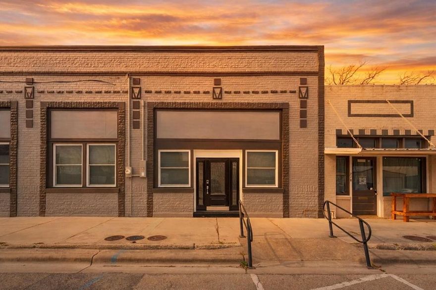 Discover luxury living in this elegantly remodeled 1 bed, 1.5 bath rare townhouse in Historic Downtown Clifton! Completely remodeled from the inside out, with top-of-the-line finishes and thoughtful design, every detail was carefully considered even the ones you can’t see. A 30 in. floor to roof firewall between units, 5-step water filtration system & a high-impact roof.

The kitchen features custom marble countertops, breakfast bar, custom made cabinetry with plentiful storage & stainless steel, energy-efficient appliances—including refrigerator, range, microwave & dishwasher! DuraLux Performance Waterproof Luxury Vinyl flooring runs throughout, complemented by handmade baseboards, crown molding & hand made Beech doors. Double hung windows with custom window coverings allow you to open from the top or bottom. Full size stackable washer & dryer are also!

Designed with accessibility in mind, the home is ADA accessible without looking like it, and includes custom pocket doors hung with industrial materials, walk-in closet with shelving, walk-in shower with a fold up bench & built-in custom cabinetry. The inside walls have been triple sanded and painted with the highest grade paint for a satin smooth finish.

The outside of the building has been painted with high-grade paint to ensure long-lasting durability that resists cracking and peeling through ever changing Texas weather conditions. A custom made outside awning is currently being completed that will run the length of the building with the address permanently placed for the ease of emergency personnel.

Additional features include stylish ceiling fans, Schlage door lock system & individual utilities. The unit has its own address, water meter, & electric meter.

If you love enjoyable restaurants, unique shopping experiences, vibrant festivals & gatherings & an artsy atmosphere, along with a tight knit small town community of business owners & residents, you don’t want to miss this opportunity!