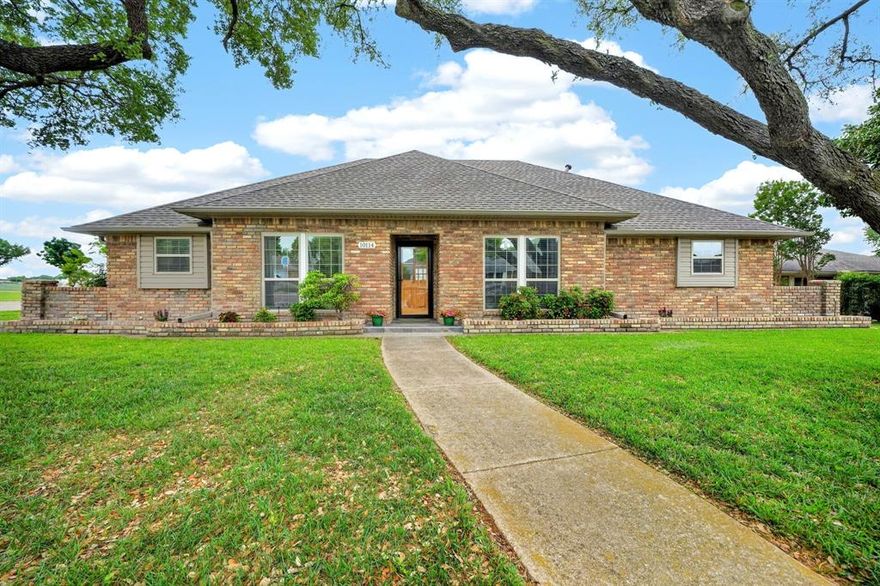 Immaculate single-story home in Richardson ISD, beautifully updated to the highest standards. This 4 bedroom, 3 bath home with a dedicated office offers an open-concept layout filled with natural light and beautiful natural wood vinyl plank flooring in the main living areas. Lovely details, including wide baseboards, crown molding, ceiling beams and a stunning white painted gas brick fireplace, create a warm yet refined living space. The chef’s kitchen features granite countertops, a modern backsplash, and stainless steel appliances, ideal for both everyday living and entertaining. The private office includes a built-in desk with storage cabinets, while the well-designed layout offers flexibility and comfort. Thoughtfully upgraded with raised ceilings, recessed lighting, updated windows, and pristine bathrooms showcasing designer finishes and glass showers. Step outside to an incredible backyard retreat featuring a custom outdoor arbor, perfect for relaxing or entertaining. The space also includes a large yard, a steel post privacy fence, mature shade trees, and a desirable corner lot setting. A truly exceptional move in ready home you don't want to miss out on!
