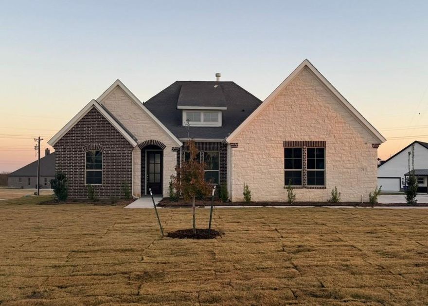 Ask us about our Trade In Trade Up program, we can buy your home! Step into the Bluebonnet by Riverside Homebuilders and embrace a lifestyle of comfort and functionality. With 4 bedrooms and 3 bathrooms sprawled over 2,686 square feet, this single-story haven offers ample space for every member of the family. As you enter through the inviting porch, the airy foyer sets the tone for the home's open layout. To the left, a flex room awaits, beckoning to be transformed into your ideal space—whether you envision a home office, gym or hobby room. Continue through the foyer to discover the heart of the home—a luminous dining room bathed in natural light. Beyond lies the main living area, a seamless fusion of the expansive kitchen, cozy family room featuring a fireplace and a charming nook adorned with picturesque windows. On the right wing of the home, privacy awaits with three traditional bedrooms and a breathtaking owner's suite. The owner's retreat boasts a spacious walk-in closet and a spa-like bathroom, offering a sanctuary for relaxation. Convenience is paramount with the laundry situated just off the bedrooms, accompanied by a mud bench near the garage entrance. To embrace the beautiful DFW weather without having to leave your home, step outside to the generous covered patio—where endless possibilities for outdoor enjoyment await. With its thoughtful design and inviting atmosphere, the Bluebonnet embodies the epitome of charming Texas living for all families alike.