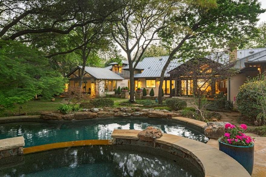 Enveloped by the winding, tree lined topography that defines Dallas’ most storied enclave, 4610 Bluffview Boulevard stands as a masterwork of scale and serenity. Set behind private gates on a rare, luscious .68 acre lot, this estate captures the Hill Country in the city essence that makes the Bluffview neighborhood so legendary. The residence unfolds over 6,545 square feet of meticulously curated space, where soaring ceilings and floor to ceiling vistas seamlessly merge the sophisticated interiors with the emerald canopy of the grounds.

The heart of the home is designed for the modern epicurean, featuring a temperature controlled wine room and a state of the art media room that promises an unparalleled cinematic experience. Retreat to the main level primary suite, a sanctuary of quiet luxury that offers a tranquil escape from the vibrant energy of the city. The home’s versatility shines through a massive gym or gameroom complete with a full bath, offering the effortless potential to serve as a fifth bedroom suite or a private wellness wing.

Transitioning outdoors, the property reveals a resort caliber oasis. The sprawling lawn gives way to an incredible pool and outdoor living space, framed by mature landscaping that ensures absolute seclusion for al fresco entertaining. Completing the estate is a generous three car garage, providing ample space for the automotive enthusiast. Offering an unmatched lifestyle of privacy and prestige, this home is a testament to the enduring allure of one of Dallas’ most architecturally significant neighborhoods.