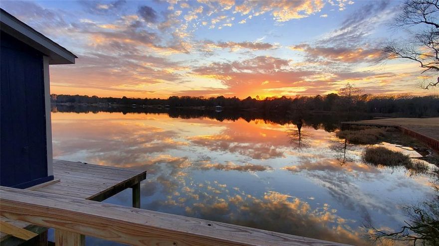 Discover your perfect getaway or forever home on Lake Quitman! This spacious property features incredible waterfront sunsets with a sturdy retaining wall and a private boat house, making it easy to enjoy boating, swimming, and outstanding bass, crappie, and catfishing. The level, manicured lot extends out from the .66-acre deeded lot line to the enclosed dock and fishing pier and is surrounded by mature shade trees, making it ideal for entertaining, hosting events, or relaxing with family and friends.  Move in READY and FULLY FURNISHED including the SUPER FUN DECOR! This home and incredibly large lot are a true RARE GEM! Boat Ramps for launch are just around the corner, and if you want to extend your fishing to Lake Fork, you are just 10 minutes away. 
With 5 comfortable bedrooms and 3 modern bathrooms, there’s plenty of space for extended family or guests. The stunning kitchen boasts quartz countertops, and the walk-in showers add a luxurious touch. Bring your boat and RV—ample covered parking is ready, hosting a 1600 sq ft shop with plumbing and electricity for all your hobbies and storage needs. A bonus is a detached home gym or office space.
Enjoy energy savings with solar panels while taking in lake views. This home is perfect for VRBO or those looking for a welcoming retreat. Make memories at Lake Quitman and experience lakeside living at its best! Perfect for VRBO, Family Gatherings, and Lakeside Living in Beautiful East Texas.
