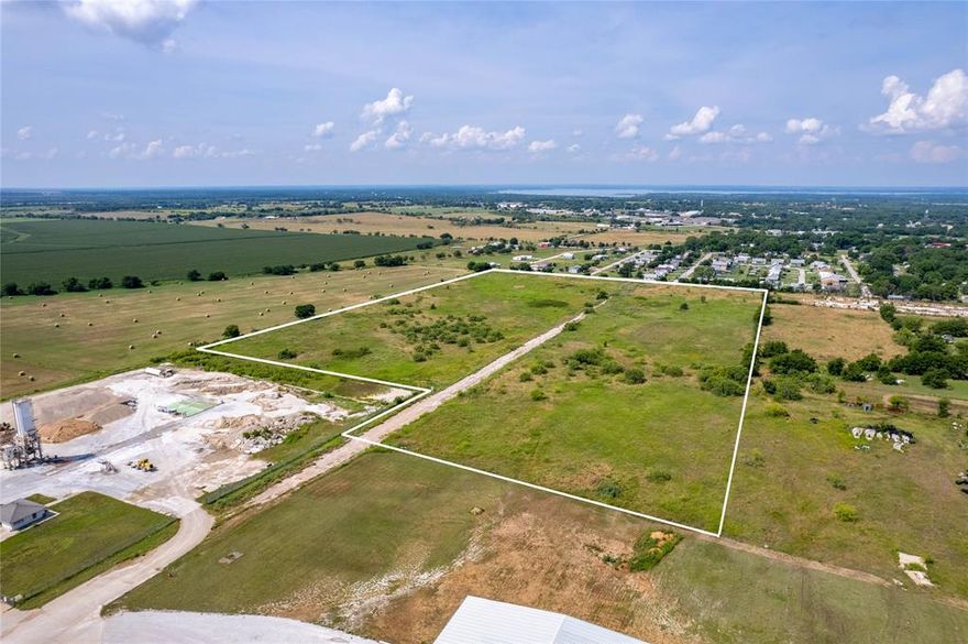 The property is divided in two tracts by a dedicated road. 8.459 Acres on the right and 12.676 Acres on the left.  This property can be used for either commercial or a residential development. City water and sewer are in place.