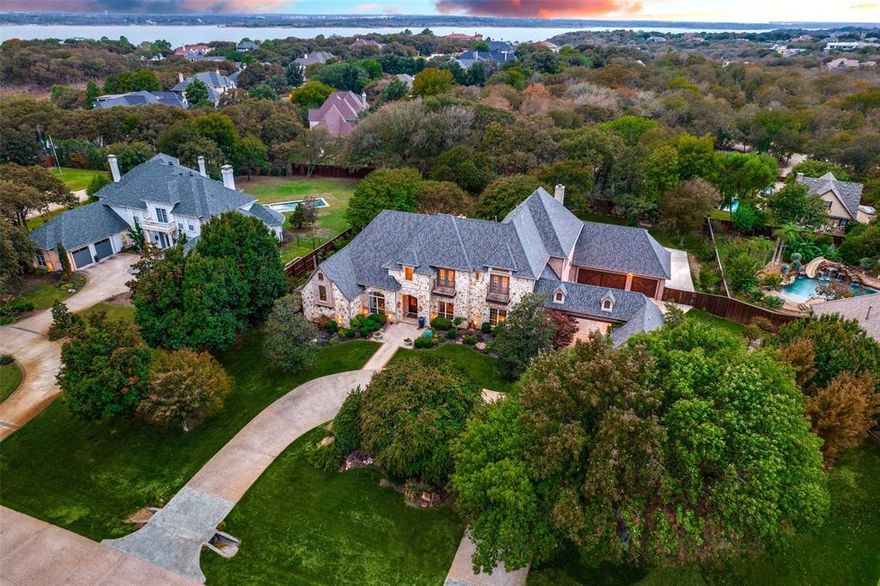 Beautifully Updated Custom Home Situated on 1 Acre in the Prestigious Guard Gated Lakeside Community of Point Noble. Boasts 4 car attached garage plus 2-car detached garage-pavilion(2019), porte-cochère & circular drive. Quality craftmanship with high attention to detail thru out this open floor plan. Wet bar, temp controlled 500 bottle wine cellar room, ice maker. Casual living open to gourmet kitchen w all high end appliances, large double Quartzite islands w prep sink, double oven, 2 warming drawers, 2 dishwashers, 690 Series Sub-Zero Fridge & Thermador 48in Pro Series Gas Cooktop. Game room w wet bar & access to balcony. Pool, spa & outdoor living. Whole HTD (Home Theater Direct) audio system including outdoor pool surround. Secure whole home automation including full internet access to; DSC security system, 4 zone IP camera system, iAquaLink pool controls, Apple HomeKit lighting & controls in key locations. Exemplary schools! Convenient to several shopping destinations & airport!