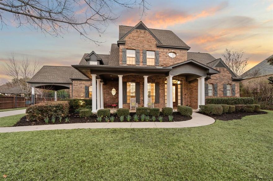 Set within the prestigious Caldwells Creek, this exceptional estate offers refined living on a sprawling half-acre lot with unforgettable curb appeal. Enjoy community walking trails, private ponds, catch & release fishing, access to the multi-city Cotton Belt Trail, and close proximity to parks and Grapevine Lake! A charming covered front porch creates a warm yet sophisticated welcome. Beyond the gated drive, you’ll find three garage spaces plus a porte-cochère. Inside, hand-scraped hardwood floors flow throughout an open-concept design highlighted by soaring ceilings and expansive windows with views of the sparkling backyard oasis. Natural light fills the living spaces, enhancing the home’s grand yet inviting atmosphere. The kitchen is beautifully appointed with light granite countertops, double ovens, a gas cooktop, center island, and breakfast bar seating — perfectly suited for both casual mornings and upscale entertaining. The adjoining family room features custom built-ins and a striking brick fireplace, creating a cozy focal point. The private primary retreat offers a serene sitting area overlooking the lush backyard and a spa-inspired bath complete with a jetted soaking tub, oversized walk-in shower, and an expansive walk-in closet. A dedicated office with built-ins provides an ideal work-from-home setting, while a downstairs guest suite with full bath ensures comfort and privacy for visitors. Upstairs, a spacious game room anchors two generously sized bedrooms, each with its own en suite bath, offering flexibility for family or guests. Step outside to your private backyard sanctuary — a large covered patio overlooks the sparkling saltwater pool and spa with a dramatic waterfall feature. Ample green space provides room to play, entertain, or simply unwind in total privacy. Conveniently located minutes from the DFW International Airport. Nearby Southlake Town Square & Historic Downtown Grapevine offer a multitude of dining and shopping options!