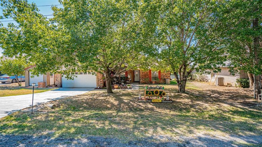 Welcome to your dream retreat-a beautifully maintained and thoughtfully upgraded home offering comfort, style, and versatility at every turn. Nestled on a spacious property with an extra lot in the back, this home provides the perfect opportunity to build your dream shop, expand your outdoor living, or simply enjoy the extra space and privacy.

Step inside to discover a warm and inviting atmosphere enhanced by modern updates and timeless charm. The heart of the home features new marble countertops that elevate the kitchen’s appeal, while the cozy fireplace creates the perfect focal point for relaxing evenings. You’ll love the sunroom-an additional 188 square feet of bright, peaceful space-ideal for enjoying your morning coffee while overlooking your serene backyard.

Comfort and efficiency shine throughout with a newer roof (2022) featuring impact-resistant shingles, newer AC (2021) still under warranty, new insulated garage door, and a newer water heater, all-electric and energy-conscious for low monthly utilities.

Practicality meets convenience with built-in cabinetry, walk-in closets, and multiple storage options, including an extra garage or storage space in front and a second storage shed in the back. Outdoors, enjoy tranquil moments by the pond or under the gazebo, surrounded by green landscaping and rain catchers for sustainable watering.

Additional highlights include a handicap-accessible shower, making this home adaptable for all lifestyles. Whether you’re entertaining guests or enjoying quiet evenings at home, this property offers the perfect blend of function and comfort.

As a bonus, the refrigerator, washer, and dryer are negotiable to stay, making your move-in seamless and stress-free.

With its unbeatable combination of thoughtful upgrades, flexible spaces, and peaceful surroundings, this property isn’t just a house, it’s a place to truly call home. Don’t miss the chance to make it yours!