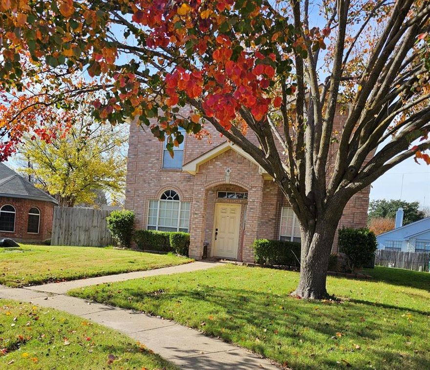 Welcome to this charming two-story beauty, perfectly placed on an oversized corner lot. With three bedrooms, 2 baths and a 2 car garage, this home offers both comfort and space. Step inside and you will be greeted with tons of natural lighting and a large living area with a beautiful fireplace. The kitchen is bright and welcoming, featuring stainless appliances, an island perfect for preparing your favorite meals.  The formal dining room showcases rich, dark wood-like flooring that adds warmth and elegance for holiday dinners. Upstairs and tucked away for privacy, the primary suite offers a peaceful retreat with a walk in closet and a spa-like bathroom complete with a garden tub surrounded by beautiful tile and double vanity sink giving you both style and function. With its natural light, inviting spaces and oversized lot, this home is more than just a place to live, its a place to gather, grow and create lasting memories.