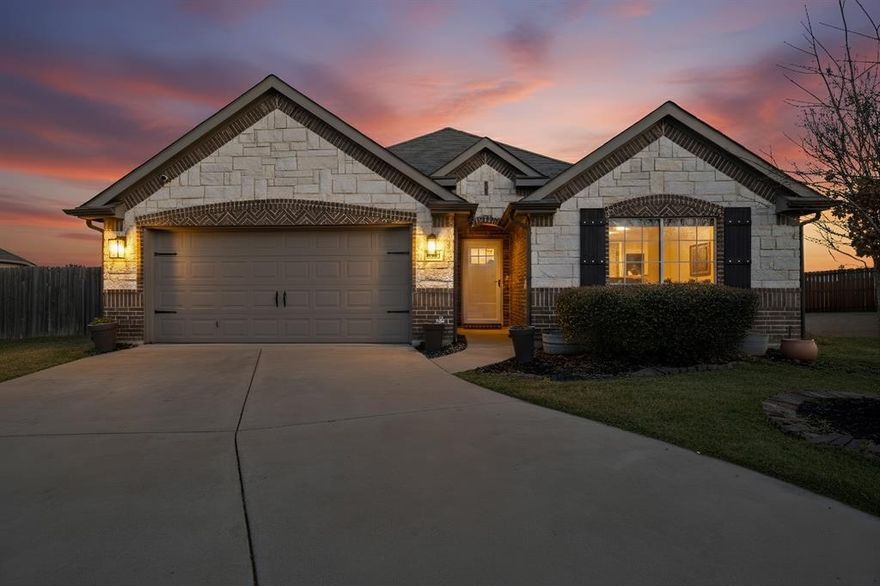 Welcome to this beautifully maintained brick home with classic stone accents, ideally situated on a quiet cul-de-sac and directly across from a small private park. This thoughtfully designed home offers both comfort and functionality in a highly desirable setting. A brand new 30-year roof with warranty available provides peace of mind, while the well-planned layout offers a true split-bedroom design, with bedrooms thoughtfully positioned on both sides of the home to create privacy and flexibility for a variety of living arrangements. Natural light fills the space throughout the day, complemented by modern updates including updated light fixtures, ceiling fans, a new front door, storm door, solar screens, and stylish contemporary touches. The open-concept kitchen is perfect for entertaining and everyday living, featuring granite countertops, beautiful lighting, and ample space for gatherings. The dining area flows seamlessly to the back porch, creating an inviting space for relaxing or hosting guests. The primary suite is a true retreat, offering generous space and an en suite bathroom with dual sinks, a separate shower and soaking tub, and a walk-in closet. Conveniently located near shopping, dining, and daily essentials, this home is approximately 15 minutes from H-E-B, 10 minutes from Sam’s Club, and close to a wide variety of restaurants and retail options—making everyday living easy and accessible. This charming, well-cared-for home combines thoughtful design, modern updates, and a prime location. Schedule your private tour today and don’t miss the opportunity to make it yours!