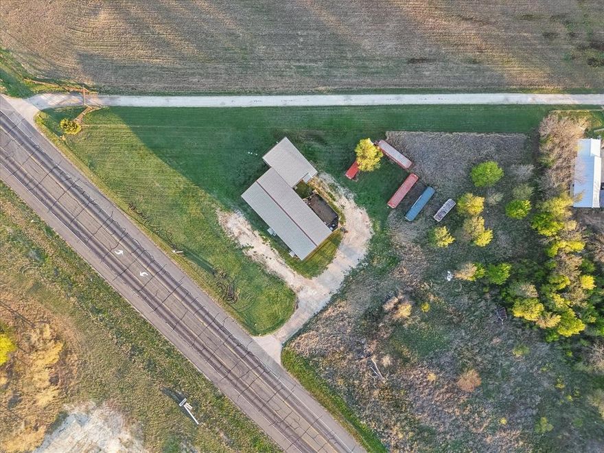 Prime commercial opportunity in Mildred ISD! This versatile property sits on 1.58 acres along busy Hwy 287, just minutes from Mildred School, offering excellent visibility and easy access. The building features a 32x26 showroom, a 2,365 sq ft warehouse, and a 15x13 office, making it ideal for a variety of business uses such as retail, service, storage, or distribution.

Also under roof are two residential apartments, including a 3-bedroom, 2-bath unit and a 1-bedroom, 1-bath unit, providing great potential for owner occupancy, employee housing, or additional rental income. The entire property is currently vacant, allowing a new owner the flexibility to configure the space to fit their needs.