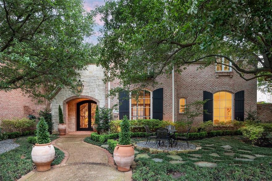 A rare gem tucked away on a quiet tree-lined street within one of the area's most sought after guarded and gated communities. This beautifully renovated home is a true example of modern luxury and timeless comfort. The open floor plan with 12' ceilings and expansive windows invite in natural light and offer tranquil views of the outdoor living area, and sparkling pool with water and fire features. The main living area features a fireplace and built-in shelving, and is adjacent to the paneled library, formal dining and a butler's pantry-bar for entertaining. The kitchen and keeping room are wrapped in designer finishes and is the perfect gathering place with a large center island, posh custom cabinetry, professional grade stainless appliances and an impressive 2000+ bottle wine cellar. The private primary suite features an elegantly appointed bath with high-end finishes, a luxurious walk-in shower, separate his and her vanities and a custom finished walk-in closet. Two generous sized secondary ensuite bedrooms with private baths are located upstairs along with a second living area which could be utilized as a game room or flex space. Other features include a whole house generator. Conveniently located within close proximity to Dallas' best shopping, dining and private school corridor! Lake Forest is comprised of 170 acres of park-like grounds with green spaces, lakes, and towering oaks. Residents enjoy walking trails, community pool, tennis & pickle ball courts, and dog parks.