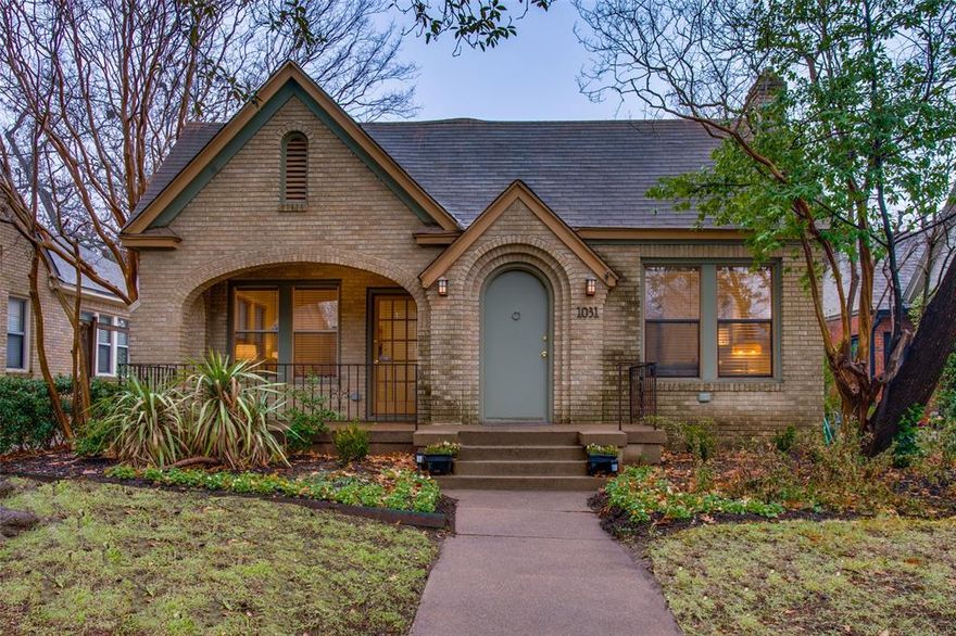 Whimsical fairytale, meet extraordinary opportunity! Located in N Oak Cliff neighborhood darling of Kessler Square, this picturesque Tudor will spark your imagination, and ignite your creativity. Enter through an enchanting arched doorway into serene, cozy spaces. Original hardwood floors, homey gas fireplace, a beautifully neutral color palate, and quaint built-in details. Living and dining spaces are generous and subtly defined, with a beautiful flow welcoming family and friends. The kitchen is intimate with a functional design, and as each day begins, the breakfast nook will be the place of early morning relaxation, and friendly conversation. The primary suite offers an attached third bedroom, beautiful nursery, or fantastic home office, while the secondary guest suite enjoys front porch access, and wonderful privacy. Nice size backyard has layered entertaining spaces and a 2-car garage with amazing storage. Exceedingly charming, incredibly desirable, exceptionally located!