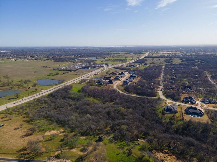 Build your dream estate on over seven acres of prime, improved land in the heart of Flower Mound! This exceptional property offers the perfect blend of privacy and convenience, providing a rare opportunity to create a custom masterpiece in a highly sought-after location. With an electric meter already installed and 27” culverts with inspected ends in place, much of the groundwork has been done—just bring your builder and let your imagination run wild! Whether you envision a luxurious private retreat, equestrian estate, or modern compound, this expansive property provides the space and flexibility to bring your vision to life. Enjoy the tranquility of country living while being just minutes from top-rated schools, premier shopping, dining, and major highways. Don’t miss this rare opportunity to own a prestigious slice of Flower Mound—schedule your private tour today!