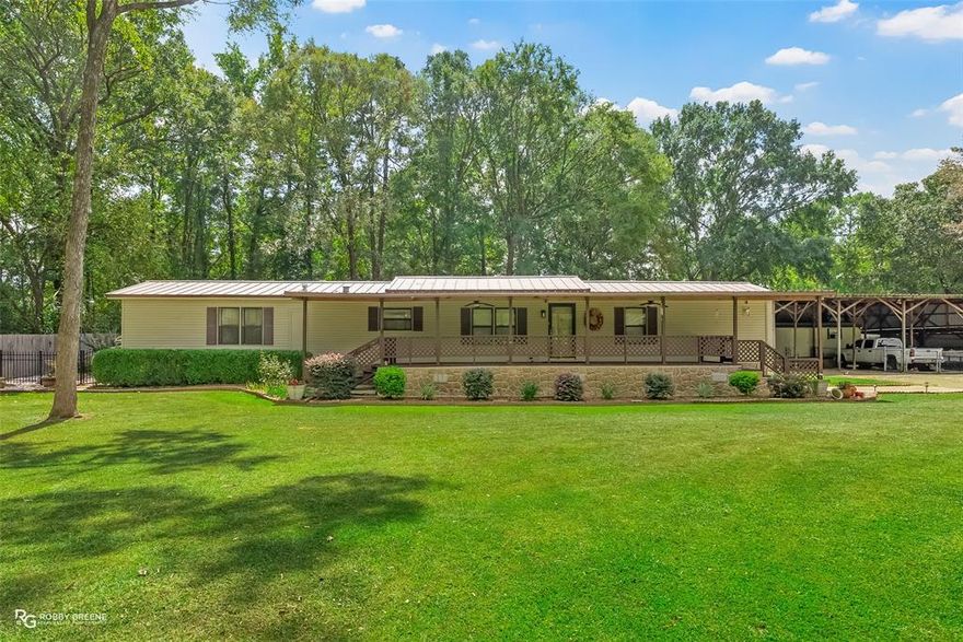 Back on the Market. Engineers Report Completed. Move-In Ready and FHA, VA, and Conventional Eligible.

This one-owner, meticulously maintained 1988 manufactured home sits on 0.66 acres in peaceful Haughton, Louisiana. Offering 3 bedrooms, 2 bathrooms, and 1,440 heated square feet, it combines comfort, practicality, and rural serenity with every major feature already in place.

The property includes a new metal roof installed in 2020, a strategically engineered five-car covered carport, and a large storage and workshop area ideal for boats, ATVs, and trailers. Inside, the home remains in excellent condition, clean, move-in ready, and thoughtfully maintained. Buyers may choose to personalize with minor cosmetic updates, but the home is turnkey as it stands.

Outdoor spaces are a highlight. The front covered porch, patio, fenced yard, and landscaping are all immaculate. Additional features include a sprinkler system, security cameras, and appliances that remain with the home including the washer, dryer, refrigerator, entertainment center, and drapery.

Utilities include a septic system with city water, natural gas, and SWEPCO electric service. The location offers the perfect blend of privacy and convenience, just minutes from I-20 with easy access to Bossier City, Shreveport, shopping, dining, and medical facilities, yet set in a quiet and safe neighborhood perfect for outdoor play and relaxation.

Schools: T.L. Rodes-Platt-Princeton, Haughton Middle, and Haughton High.
Financing: FHA, VA, or Conventional loan types.