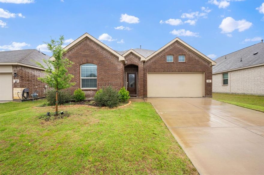 There’s something really comfortable about this home—it doesn’t try too hard, it just works. And with the seller offering up to $10,000 toward closing costs with use of the preferred lender, it becomes an even more accessible opportunity to get into a newer McKinney home. Built in 2023, this 3-bedroom, 2-bath, 1,606 sq ft home offers a simple, modern layout that feels easy the moment you walk in.
Inside, the open main living area is filled with natural light and creates a calm, usable space for everyday life—whether that’s quiet nights in, hosting friends, or simply having room to spread out without feeling crowded. The kitchen sits at the center with quartz countertops, stainless appliances, and a layout that keeps cooking, conversation, and daily routines connected and uncomplicated. Thoughtfully designed, the floor plan creates real separation where it matters most, with the primary bedroom set apart from the secondary rooms for added privacy and quiet, while the secondary bedrooms stay well-sized and flexible for family, guests, or a home office.
Out back, a fenced yard and covered patio extend the living space in a simple, low-maintenance way—ideal for grilling, relaxing outside, or letting pets enjoy the yard. Located in The Preserve at Honey Creek, the neighborhood offers a community pool, parks, and a relaxed atmosphere that makes it easy to settle into daily life. Zoned to award-winning McKinney ISD and close to everyday shopping, dining, and continued growth in the area, it’s a home that fits first-time buyers, those looking to simplify or downsize, and investors seeking a strong, low-maintenance rental option. It’s the kind of place that quietly works for a wide range of lifestyles.