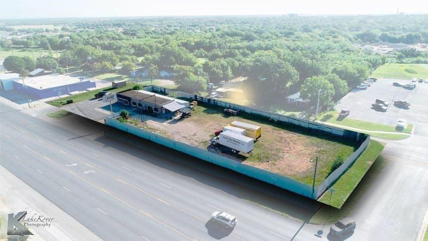 Great commercial property! Discover the potential that this versatile property has to offer in a prime location. The building features office space with plenty of climate controlled storage and warehouse storage. The storage makes the ideal location for various operational needs with an added security system and convenience. The building features new plumbing, toilets, interior and exterior paint and new luxury plank vinyl flooring.  There is also a new breaker box panel.  The property is sitting on a large corner lot providing ample parking. The enclosed fenced area in the back is ideal for storing equipment, materials and vehicles. Lots of room for your business to grow.