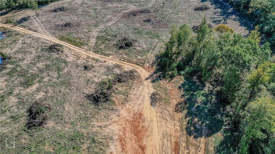 This deal just doesn't just come along ...65 acres and is perfect to create your own pad or develop your next subdivision . Timber has already been cut and owner is cleaning the land currently and have it ready to go . Two ways to access the land : house and land are on the Greenwood Road that house 5 acres and backs up to the remaining 60 acres. You can also enter onto Calderwood Drive and turn right onto Lambert . Go to the very end to enter the additional 60 acres. Call today for additional information and Plat.