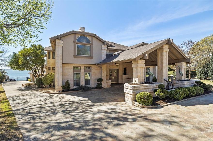 A Rare Lakefront Masterpiece! Discover an extraordinary, nearly 9,000 sq. ft. lakefront estate that offers the pinnacle of luxury living.
Perfectly positioned for breathtaking skyline & water views, this one-of-a-kind residence boasts a private boat dock, a resort-style pool, & an expansive outdoor living area complete with a summer kitchen & fire pit—an entertainer’s dream. A grand porte-cochère welcomes you to this meticulously maintained home, where a soaring foyer opens into an elegant living space & a stately dining room with a fireplace, ideal for hosting 
 unforgettable gatherings. The chef’s kitchen is a true showpiece, seamlessly flowing into a bright breakfast area. Designed for both entertainment & relaxation, the home features a spacious game room & family room, complete with a full wet bar, all opening to the outdoor paradise. The owner’s suite is a private retreat, offering a serene sitting area, an oversized spa-inspired bath, & mesmerizing lake views. Upstairs, a sprawling living area showcases unmatched sunset & skyline vistas, extending onto a Florida room for year-round enjoyment. Work from home in the stunning office, where panoramic lake views inspire productivity. Guests will feel indulged in their private suites, each with large walk-in closets & luxurious baths.
This home is truly without comparison, offering an unparalleled waterfront lifestyle. Schedule your private showing today!