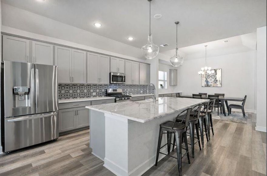 Welcome home to this beautifully designed residence in the highly sought-after Tavolo Park community of Fort Worth. From the moment you step inside, you’ll feel the openness and warmth created by the expansive open-concept layout, perfect for everyday living, entertaining, and making memories. The heart of the home flows effortlessly from the living area to the kitchen and dining space, while a versatile flex room offers endless possibilities as a home office, playroom, workout space, or second living area designed to adapt to your lifestyle. The private primary suite is a true retreat, complete with a custom-designed closet that offers both function and luxury, giving you the organization and space you’ve been dreaming of. Situated on a desirable corner lot, this home provides added privacy and curb appeal while still being just steps away from everything Tavolo Park has to offer. Enjoy access to an impressive amenities center, resort-style pool, scenic walking trails, and playground creating a neighborhood where community and connection truly thrive. This is more than a house, it’s an opportunity to live in one of Fort Worth’s most vibrant master-planned communities.