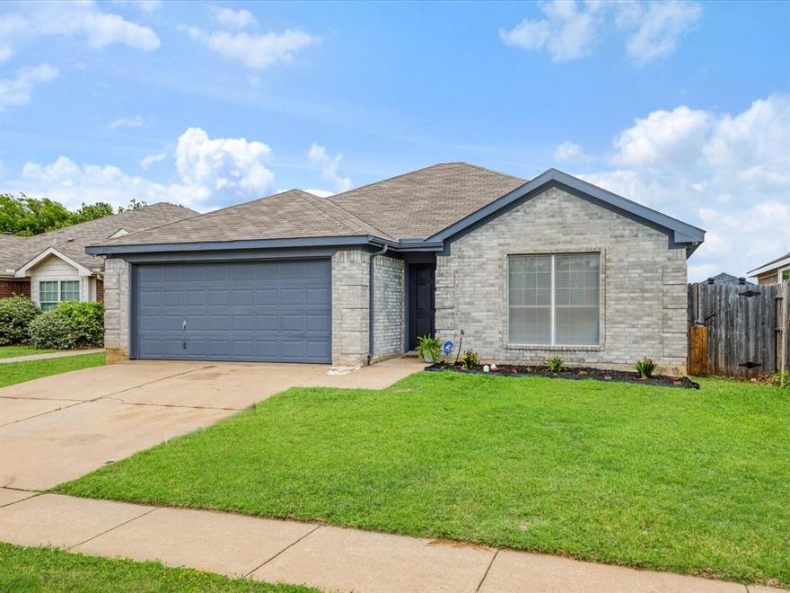 Now offered at an incredible new price of $219,900, with the refrigerator, washer, and dryer included. This move-in ready home delivers both value and functionality. Built in 2006, this thoughtfully updated 2-bedroom, 1-bath home features a practical layout designed for everyday living. The current owners’ change in plans creates an opportunity for the next owner to step into a well-maintained and updated space. Recent improvements include fresh interior paint, refreshed exterior paint including the front door and garage, and updated flooring throughout most of the home, offering a clean, low-maintenance feel. One bedroom features carpet for added comfort, while the remaining spaces showcase updated flooring. The living area is anchored by a custom-crafted fireplace surround and mantle, adding character and a warm focal point. Natural light fills the home through multiple windows, enhancing the open feel of the space. Additional interior features include updated ceiling fans, oversized closets, and a dedicated pantry for added storage. The finished garage adds versatility with built-in cabinets, a countertop workspace, and shelving, ideal for storage, hobbies, or projects.
Outside, enjoy a spacious, fully fenced backyard with a patio area, offering room to relax, entertain, or personalize. Located in Fort Worth with convenient access to schools, shopping, and close proximity to Chisholm Trail Parkway, this home combines comfort, updates, and everyday convenience at an attractive price point.