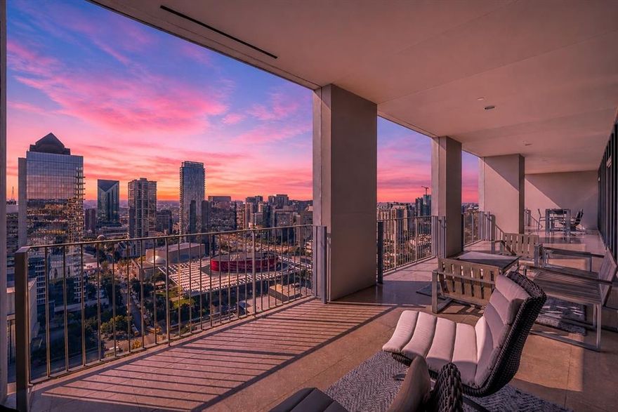 Experience elevated luxury living in this breathtaking penthouse residence at One Arts Plaza, perfectly positioned above the vibrant Downtown skyline and renowned Dallas Arts District. Designed with impeccable attention to detail, this extraordinary home blends sleek contemporary architecture with refined sophistication at every turn. Rich hardwood flooring, gallery-style walls, soaring 11-foot ceilings, and automated shades create a dramatic yet inviting atmosphere, while expansive floor-to-ceiling windows frame stunning panoramic city views and flood the interiors with natural light. An advanced lighting system sets the perfect ambiance for both everyday living and elegant entertaining.

At the heart of the residence, the chef’s Bulthaup kitchen is a true showpiece, featuring full-height lacquer cabinetry, premium Miele appliances, gas cooktop, SubZero refrigeration, dual wine refrigerators, and a dedicated ice maker. A sophisticated wet bar seamlessly connects to the expansive living and dining spaces, where dual seating areas offer effortless flow for intimate gatherings or large-scale entertaining against the dazzling backdrop of the Dallas skyline.

The private primary suite is a serene retreat, complete with a dedicated study, a spa-inspired marble bath, and a custom Poliform closet designed to rival the finest luxury boutiques. Combining world-class design, unmatched amenities, and an iconic location in the heart of Dallas, this one-of-a-kind penthouse delivers an exceptional lifestyle defined by elegance, comfort, and modern sophistication.