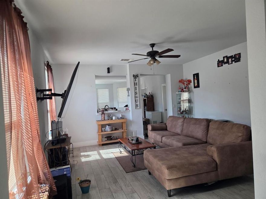 This home still boast some newness based on it was only lived in for 2 years. Walking into the home you are entering the living area that's ready for entertaining friends and family. It has a ceiling fan and nice size windows.  Off the living room there's a hallway leading to the guest bathroom and 2 bedrooms.  Leading from living room into the nice size eat in kitchen that has a nice size island  pantry and utility closet with washer dryer connections

There's a door leading into the nice cozy backyard with plenty of shade. 

This home is located on a street with no outlet therefore there's no drive thru traffic and its very secluded and quiet area.