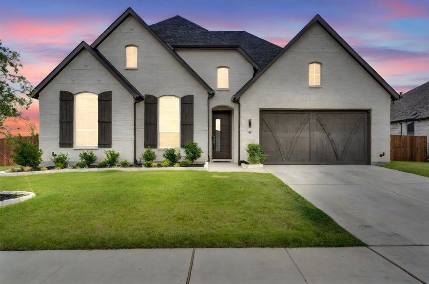 1% of loan amount, lender credit if you use preferred lender! See MLS docs for info. Welcome to your dream home in the highly sought-after Dove Hollow neighborhood of Waxahachie! This stunning one-owner residence, built in 2023, is perfectly situated on a spacious corner lot and offers the perfect blend of elegance, comfort, and functionality. With 4 generously sized bedrooms, a dedicated office, and a media room, this home was designed to meet the needs of both everyday living and entertaining. Step inside to find a beautifully designed interior featuring luxury vinyl plank flooring in the main living areas and cozy carpet in the bedrooms and media room, creating a warm and inviting atmosphere throughout. The heart of the home is the luxurious master suite, which feels like a private retreat with its Hollywood-style bath, oversized soaking tub, separate glass-enclosed shower, and dual vanities. The open-concept layout flows effortlessly, offering both space and versatility, while the kitchen and living areas are perfect for gatherings of any size. Step outside to enjoy the privacy-fenced backyard complete with a covered porch—ideal for morning coffee or evening relaxation. With its modern finishes, thoughtful layout, and prime location in one of Waxahachie’s newest and most desirable communities, this home is an absolute must-see!