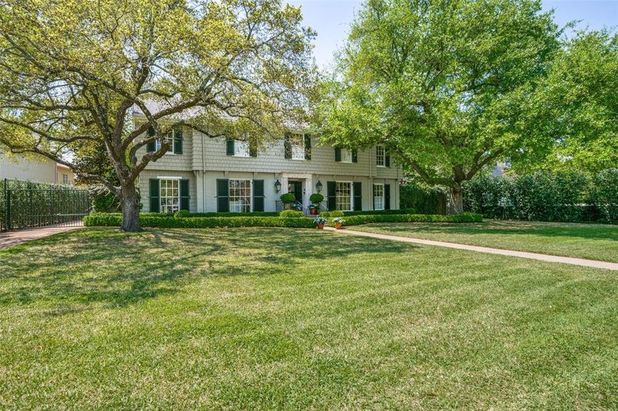 Welcome to classic traditional elegance at its best.  From the entry and throughout, this beautifully appointed home offers exceptional style. The property has been featured in design magazines several times. The current owners have made many quality updates. The center hall floor plan has beautiful light wood floors; floor to ceiling windows; large gracious formals; pretty moldings; designer lighting. Downstairs has a library and den both with wonderful built ins. The light, bright kitchen offers a combination of marble. stainless, and beautiful cabinetry with glass fronts, a large pantry and great storage. Off the kitchen is a breakfast room looking out on the picturesque back yard.  Upstairs has 4 wonderful bedrooms with a large primary with walk in closet, well planned separate office, and elegant ensuite bath.  The other 3 bedrooms are up with one being more private for a guest room; each bedroom has it's own bath. There is also a playroom or sitting room upstairs.  Some other features are an elevator; a private garden and patio off the kitchen; and a fabulous charming guesthouse at back of house with separate entrance and large inviting screened porch.  The back yard is beautifully landscaped with a lovely sitting area and firepit.  Don't miss this combination of sophisticated charm in one of the best locations in Dallas.